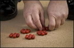 Referee setting 49 marbles